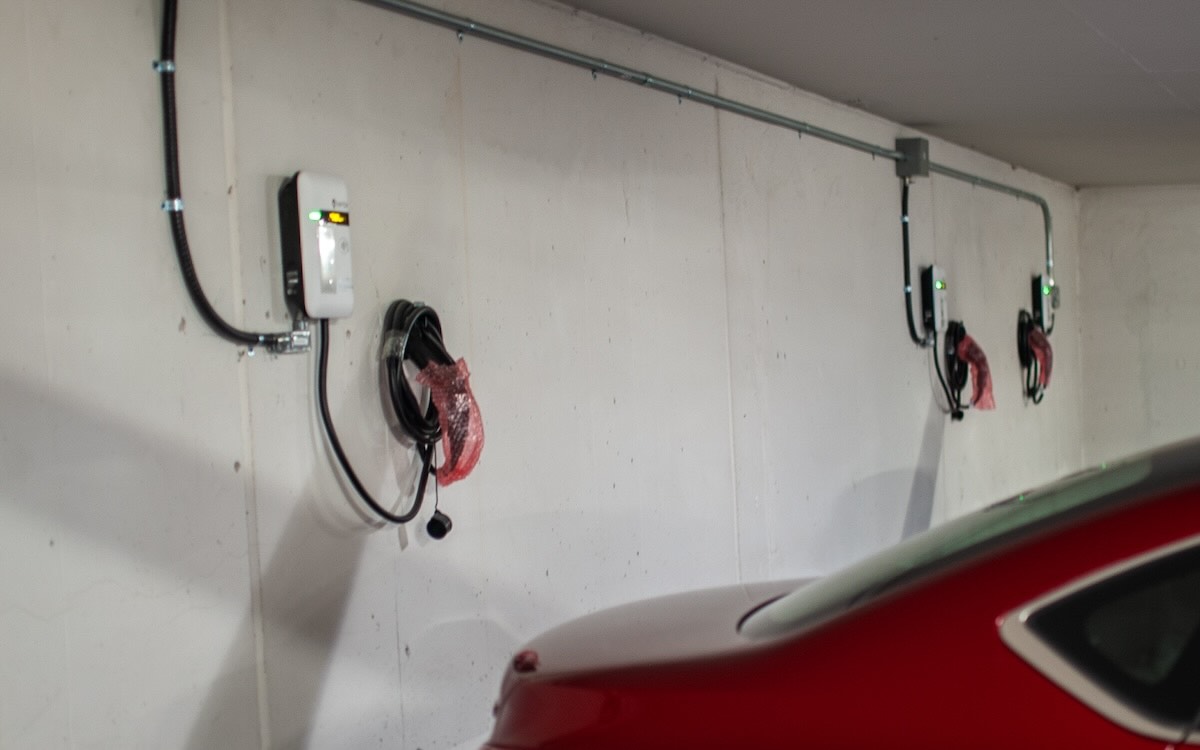 Dozens of EV charging stations in this condo garage have been installed but not yet activated. Now, participating residents have access to home charging when they need it — either in the short term or down the road.