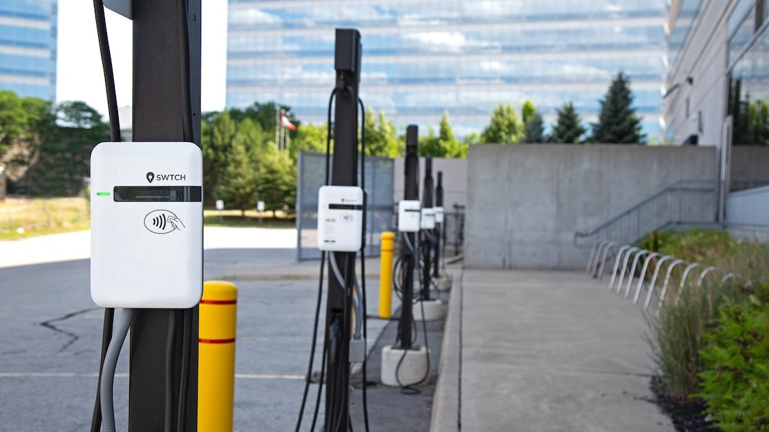An image that shows a number of level 2 EV chargers in a row at a single location.