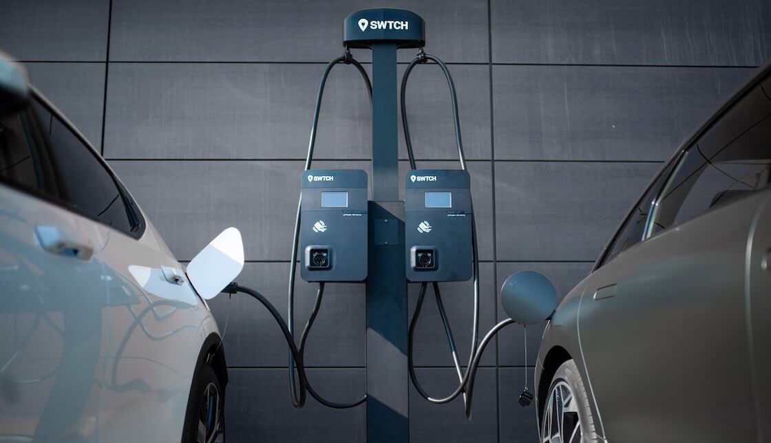 An example of EVs plugged into a pair of chargers that are side by side